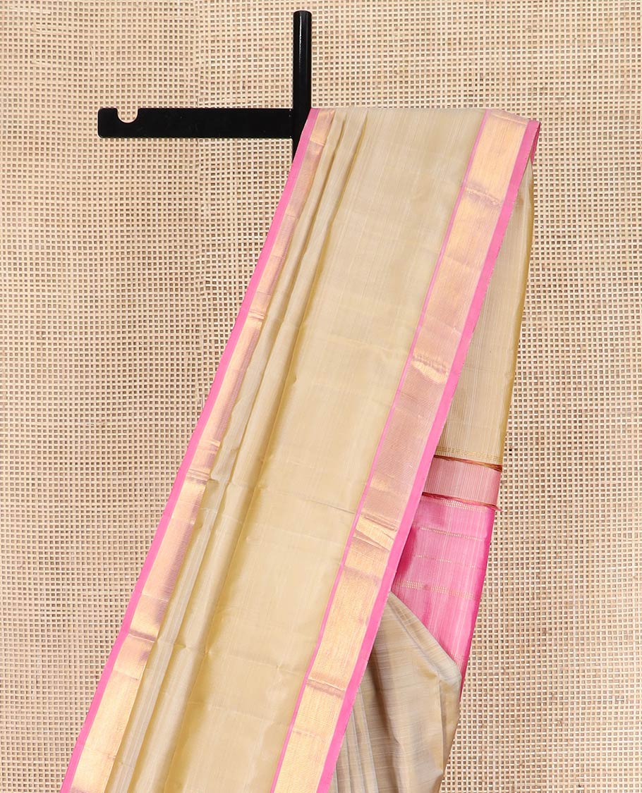 Light Sandal Plain Kanchipuram Silk Saree Subtly Sparkled with Contrast Zari Border, Pallu Features Zari Designs, and Paired with a Contrast Blouse