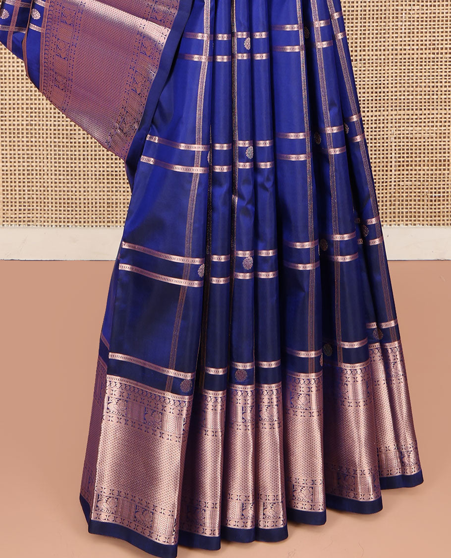 Blue Kanchipuram Silk Saree, Delicately Woven with Zari Buttas and Checked Design All Over Its Body, Highlighted by Zari Border of Manga Mokku, Paisa, Mayil, and Mayil Kann Designs, a Grand Jaal Pallu, and Paired with a Matching Blouse