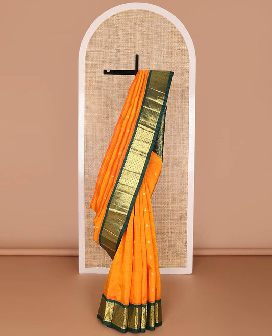 Orange kancheepuram silk saree with zari buttas, contrast one-sided korvai border of salngai & jaal design, & pallu of floral designs