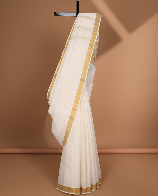 Cream kerala saree with zari designs, plain border & pallu of intricate zari designs