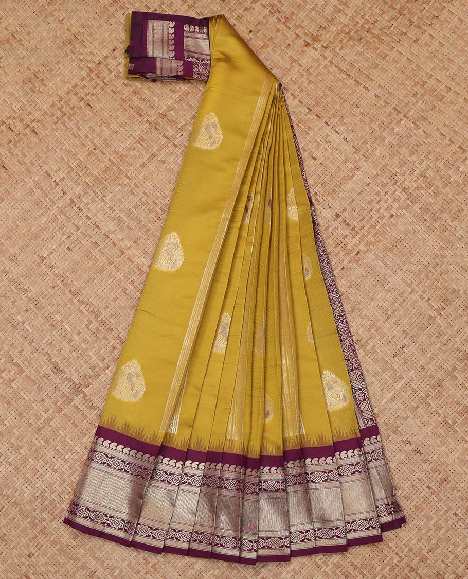 Green Litchi Saree, Enriched with Zari Buttas and Stripes, a Contrast Traditional Zari Border, a Grand Pallu, and a Contrast Blouse