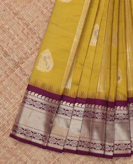 Green Litchi Saree, Enriched with Zari Buttas and Stripes, a Contrast Traditional Zari Border, a Grand Pallu, and a Contrast Blouse