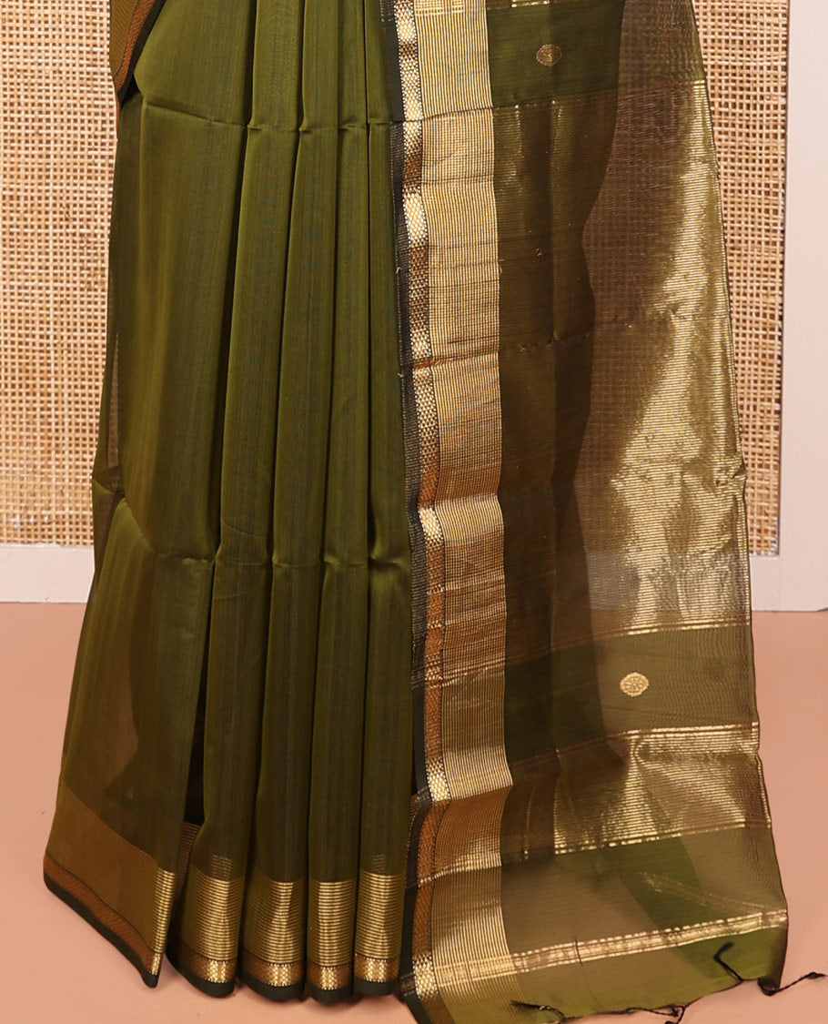 Green Maheshwari Cotton Saree, Beautifully Bedecked with Buttas All Over Its Body, Highlighted by a Zari Traditional Design Border, Pallu Gleamed Up with Zari Stripes, and Paired with a Matching Blouse
