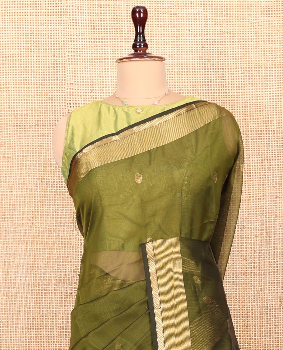 Green Maheshwari Cotton Saree, Beautifully Bedecked with Buttas All Over Its Body, Highlighted by a Zari Traditional Design Border, Pallu Gleamed Up with Zari Stripes, and Paired with a Matching Blouse