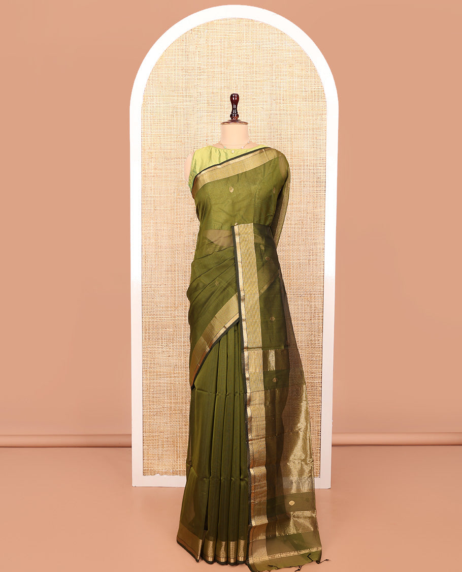 Green Maheshwari Cotton Saree, Beautifully Bedecked with Buttas All Over Its Body, Highlighted by a Zari Traditional Design Border, Pallu Gleamed Up with Zari Stripes, and Paired with a Matching Blouse