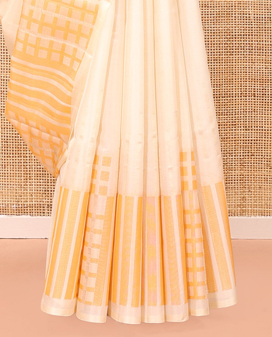Borderless Cream Mayuri Soft Silk Saree, Boldly Accentuated with Checks On Its Body, Highlighted by Self-Pallu of Geometric Patterns, and Paired with a Matching Blouse