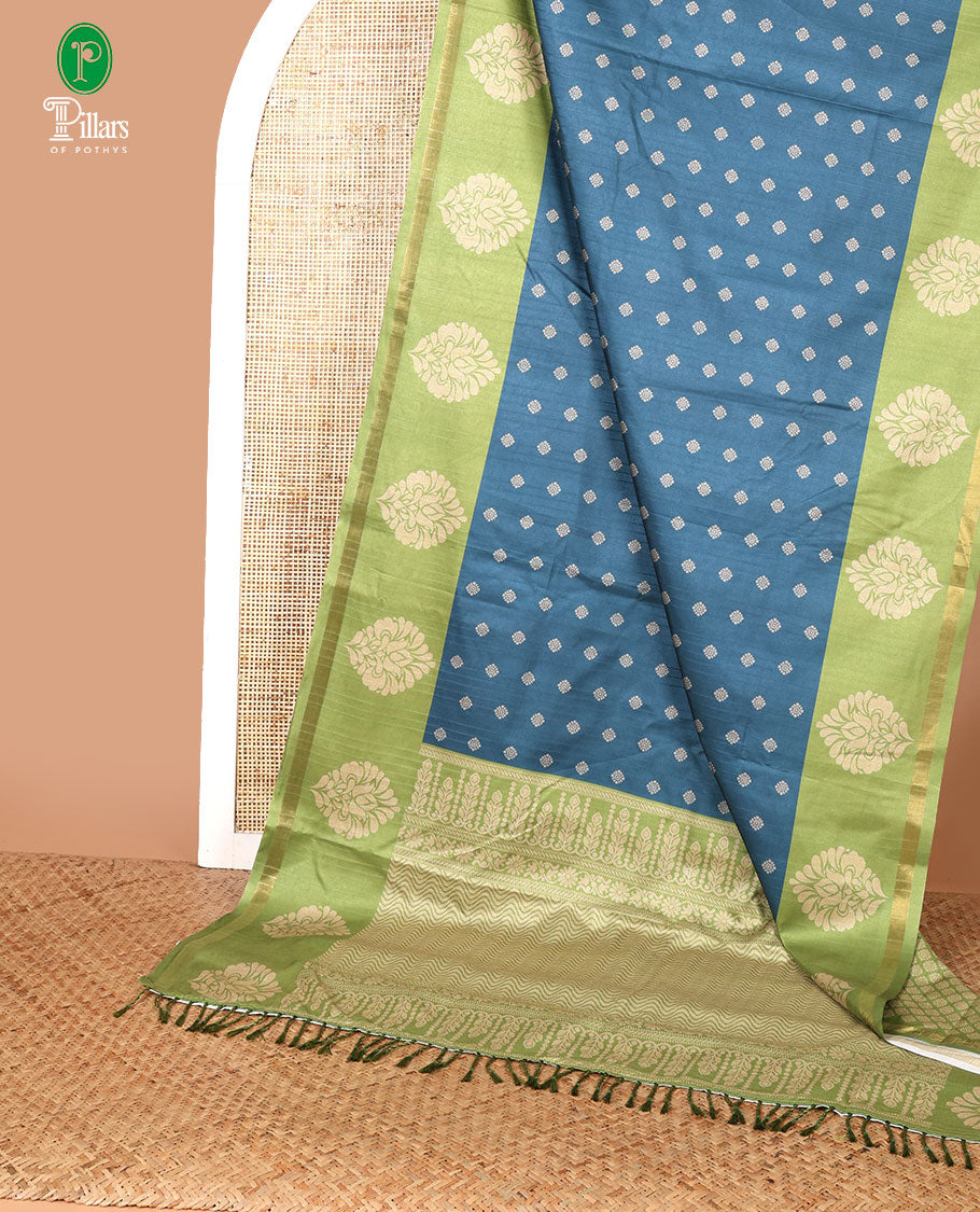 Blue with parrot green butta printed kathan silk saree with contrast floral zari border & rich printed pallu along with printed blouse