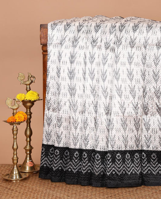 White ikat-style printed Litchi crushed saree, contrast black ikat border, pallu of ikat chevron & dots & ikat printed blouse