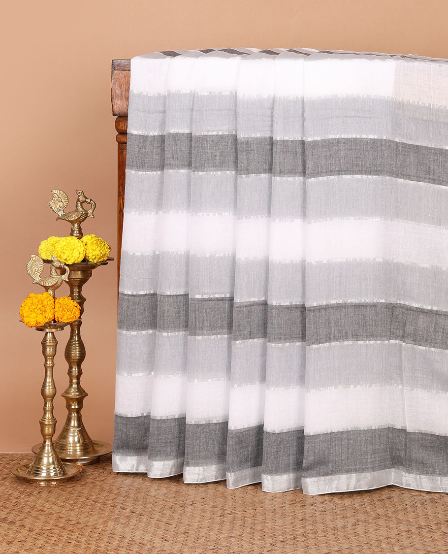 Grey-shaded striped khadi cotton saree, zari piping border, multi-color tassels pallu & colorful striped blouse