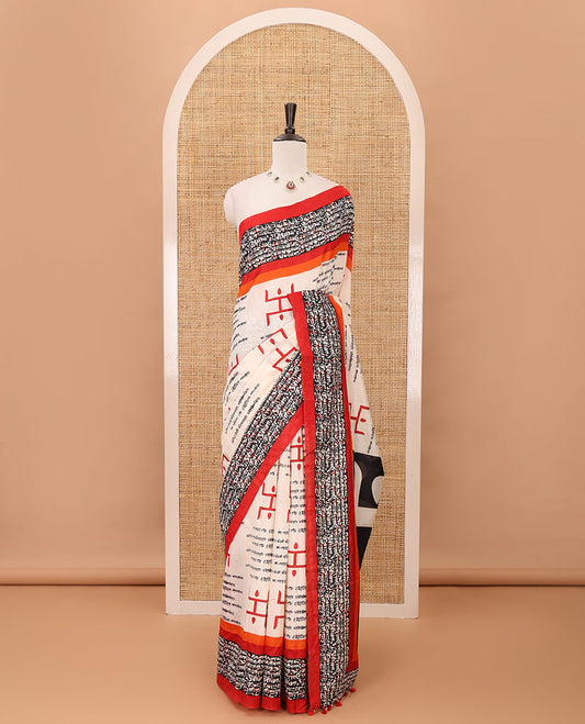 Chikku color swastika & Hindi typography printed jute cotton saree, contrast printed border, printed pallu & plain blue blouse
