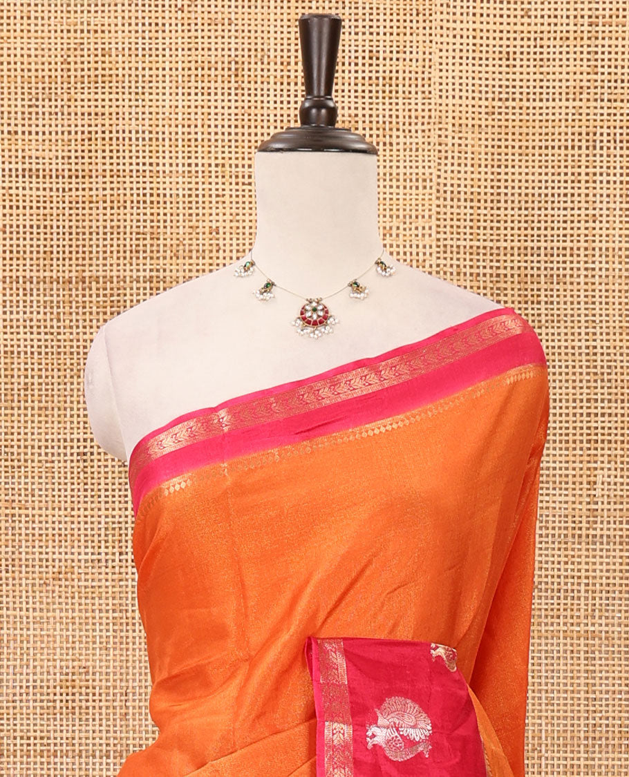 Orange plain Banarasi tissue silk saree, contrast traditional zari peacock border, zari striped pallu & floral jaal jacquard red blouse