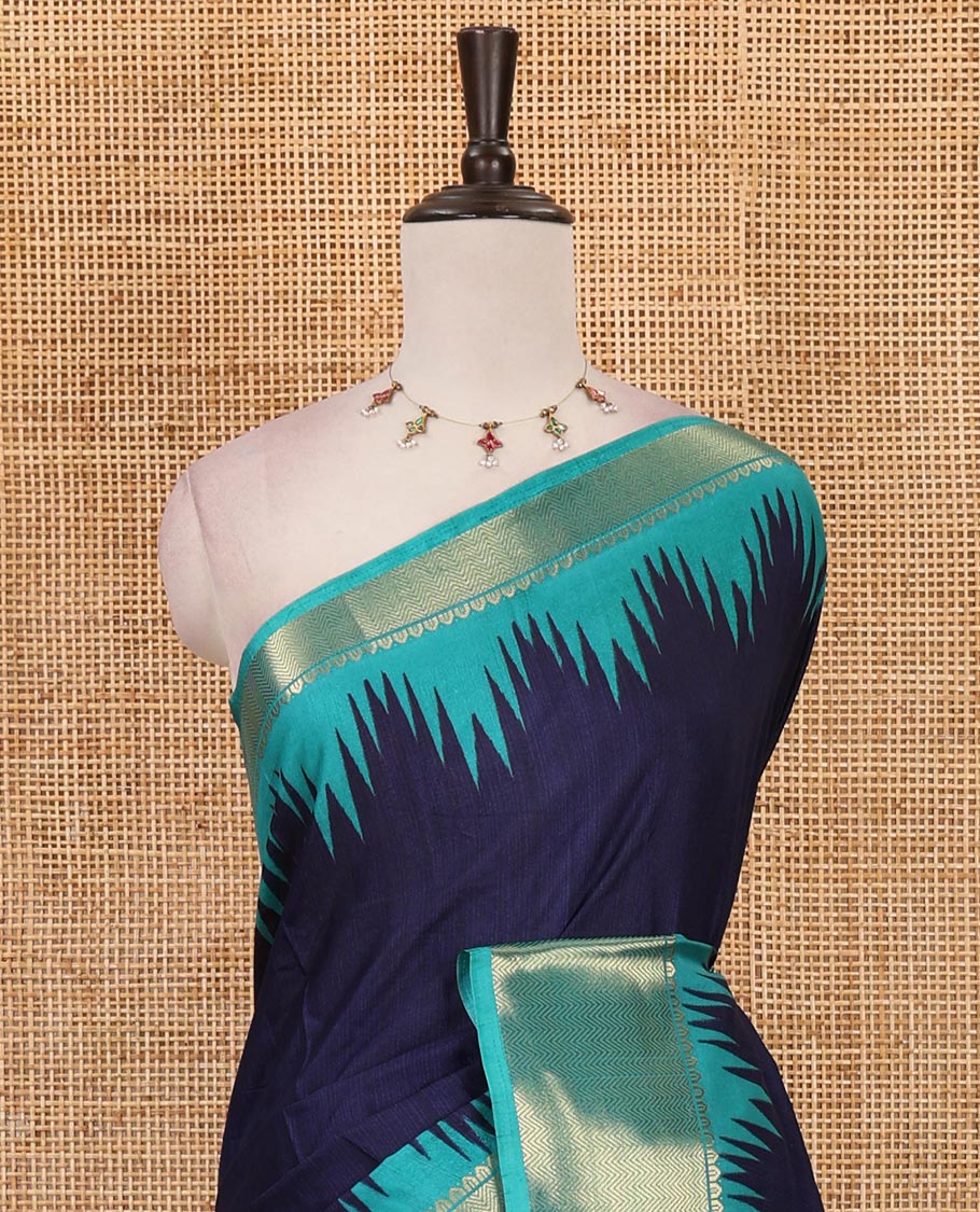 Navy blue plain dola-tussar saree, contrast temple zari border, patola animal motifs enclosed jaal printed pallu & patola printed blouse