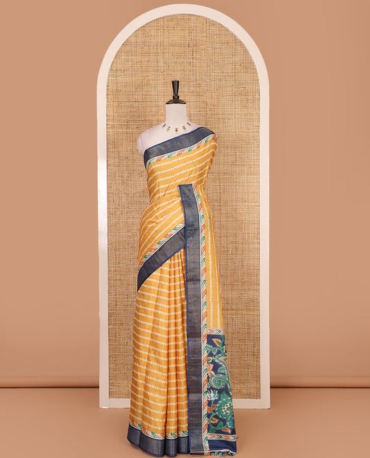 Mustard shibori-style printed soft-tussar saree, contrast zari border, kalamkari peacock printed pallu & kalamkari floral vine print contrast blouse