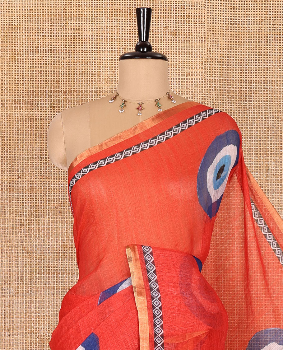 Red evil eye motifs printed linen cotton saree, diamond motifs printed with piping border, chevron printed pallu, and a matching blouse