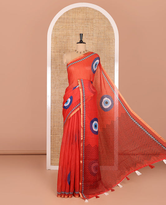 Red evil eye motifs printed linen cotton saree, diamond motifs printed with piping border, chevron printed pallu, and a matching blouse