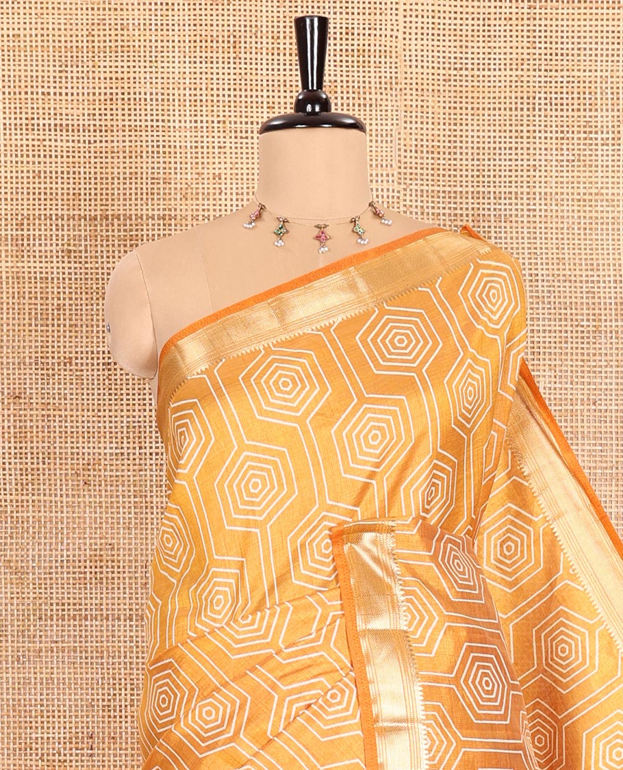 Mustard Semi-Tussar Saree Subtly Sparked with Hexagonal Geometric Patterns Printed All Over Its Body, Featuring Traditional Zari Design Border, Gleaming Zari Striped Pallu, and a Matching Blouse