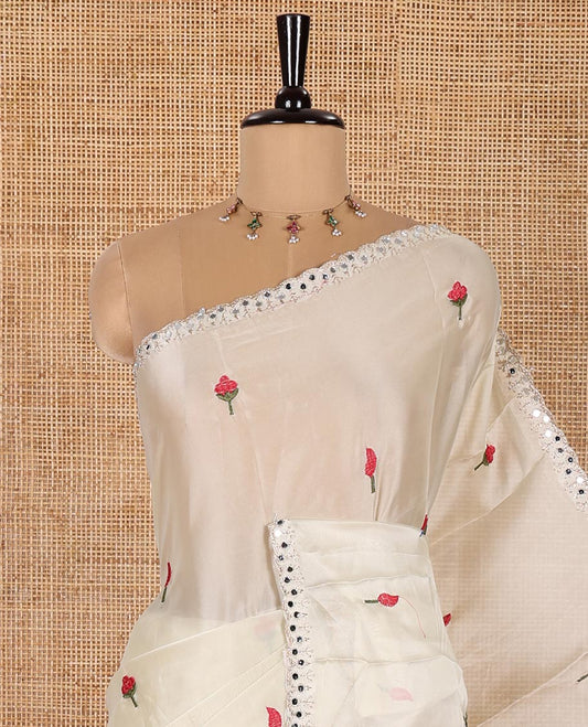 Cream and Rani Rangoli Saree, Prettified with Flower Butta Embroidered All Over Its Body, Scallop Mirror Embroidered Border, Pallu Artfully Woven with Floral Motifs Embroidery, and Paired with a Contrast Embroidered Blouse