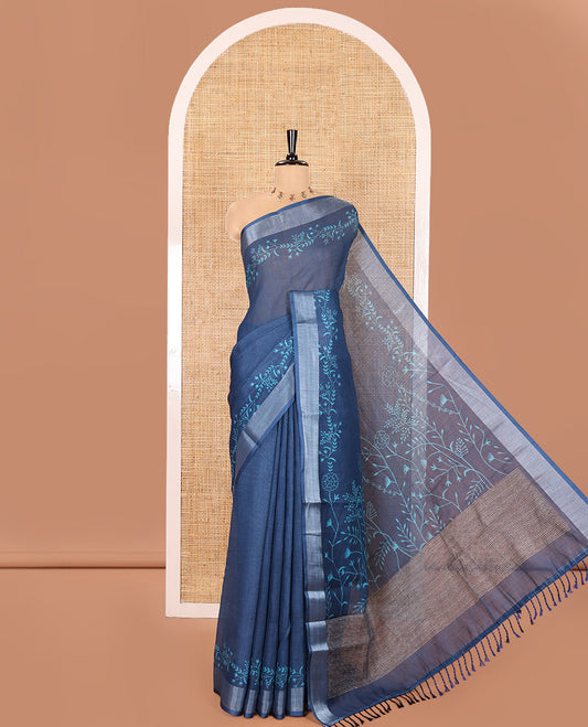 Blue Linen Cotton Saree, Subtly Sparkled with Floral Vine Motifs Printed All Over Its Body, Subtle Bavanji Border, Pallu Steeped with Stripes, and Paired with a Floral Printed Blouse
