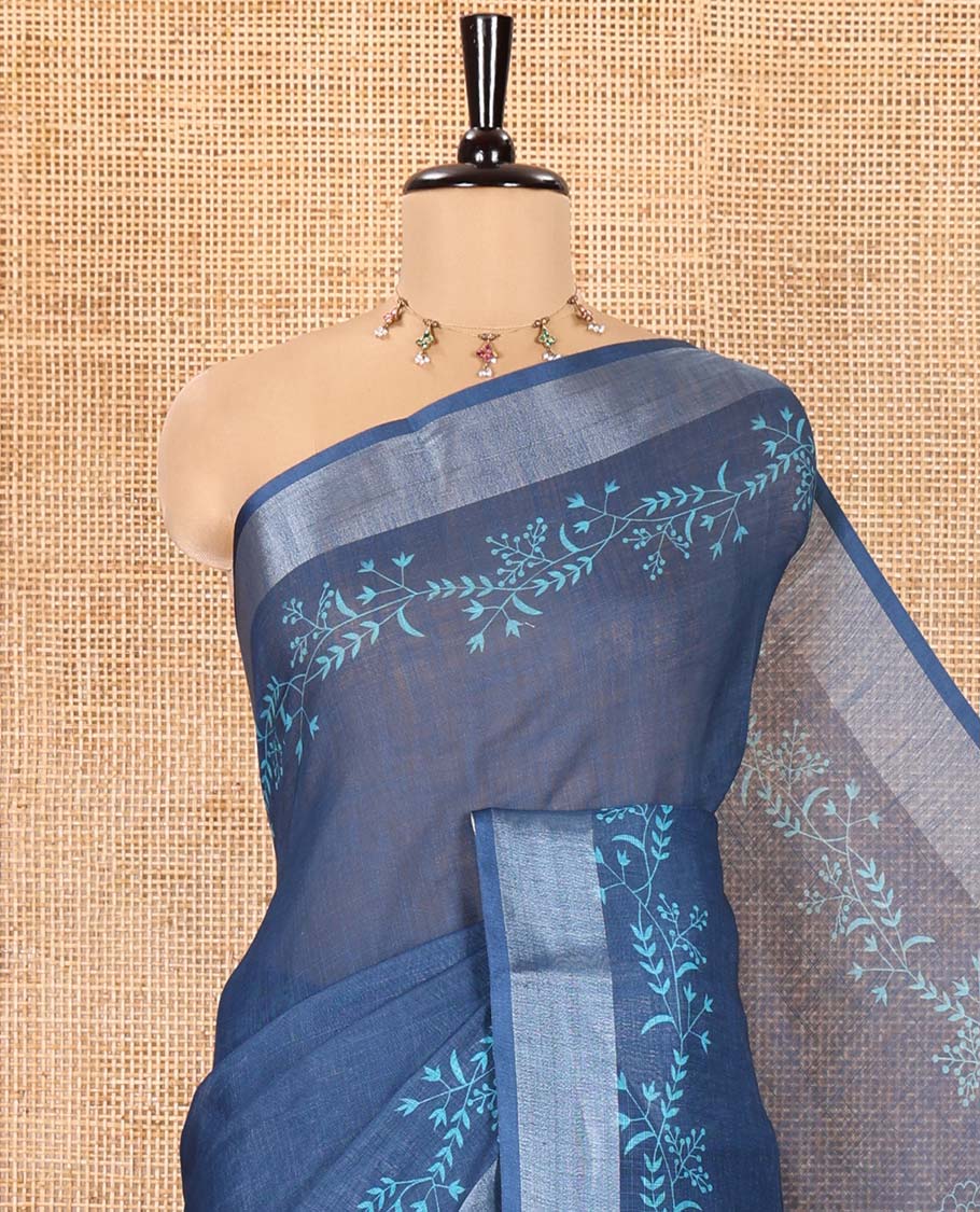 Blue Linen Cotton Saree, Subtly Sparkled with Floral Vine Motifs Printed All Over Its Body, Subtle Bavanji Border, Pallu Steeped with Stripes, and Paired with a Floral Printed Blouse