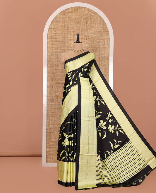 Black and Yellow Satin Crepe Saree, Highlighted with Floral Vine Print All Over Its Body, Complemented by a Contrast Foil Printed Checked Border, Pallu Steeped with Stripes, and Paired with a Matching Blouse