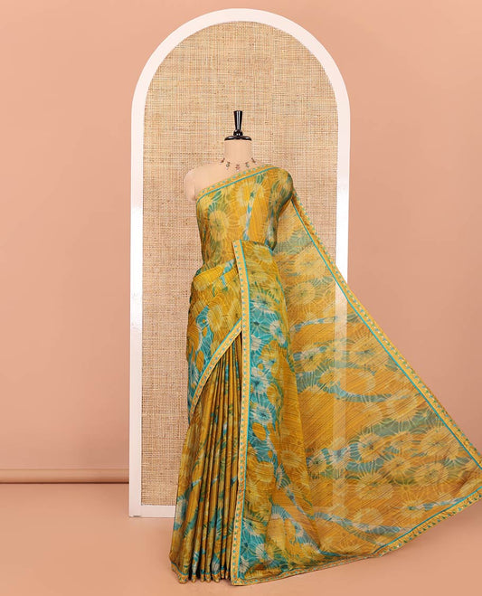 Mustard Chiffon Saree, Accentuated with Flower-Like Patterns Printed on Its Body, Subtle Lace Border, Pallu with the Same Print, and Paired with a Contrast Blouse