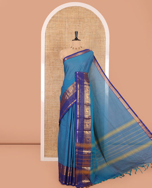 Blue Chettinad Cotton Saree, Sparkled with Vertical Stripes on Its Body, Complemented by a Contrast Traditional Zari Border of Peacock Designs, Subtly Striped Pallu, and Paired with a Matching Blouse