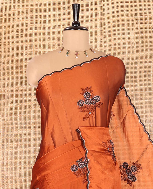Rust Rangoli Chiffon Saree, Adorned with Flower-Style Motifs Embroidered on Its Body, a Subtle Scallop Embroidered Border, a Self-Pallu, and Paired with a Contrast Embroidered Blouse