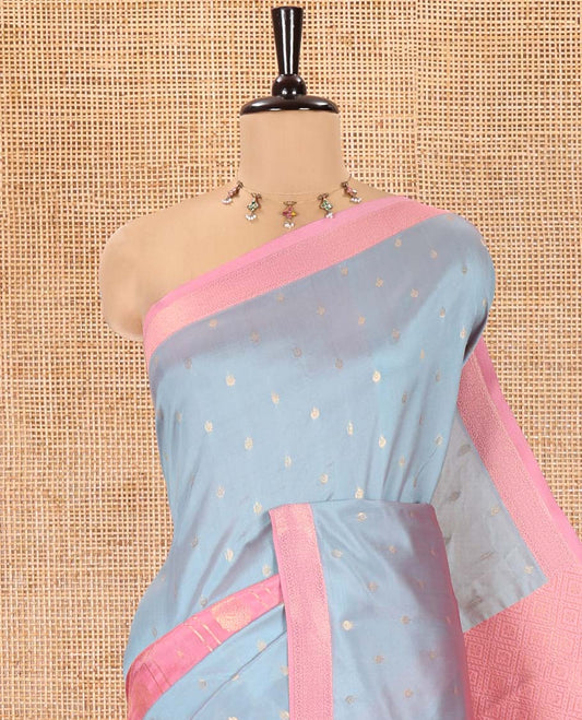 Grey and Pink Kanchi Silk Saree, Subtly Enriched with Zari Buttas and Buttas Enclosed Checks On Its Body, Complemented by Zari Border, Jaal Pallu, and Paired with a Contrast Jacquard Blouse