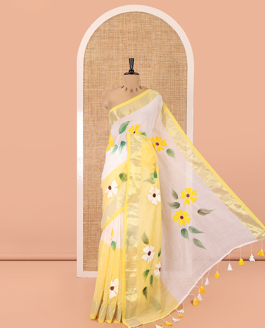 Cream and Yellow Khadi Mul Cotton Saree, Adorned with Hand-Brush Painting-Style Floral Block Printed Body, a Subtle Gold Zari Border, a Self-Pallu, and Paired with a Matching Blouse