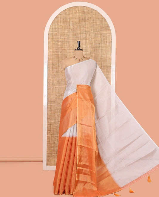 Borderless Orange Plain Tissue Saree, a Self-Pallu with Tassels, and a Matching Blouse