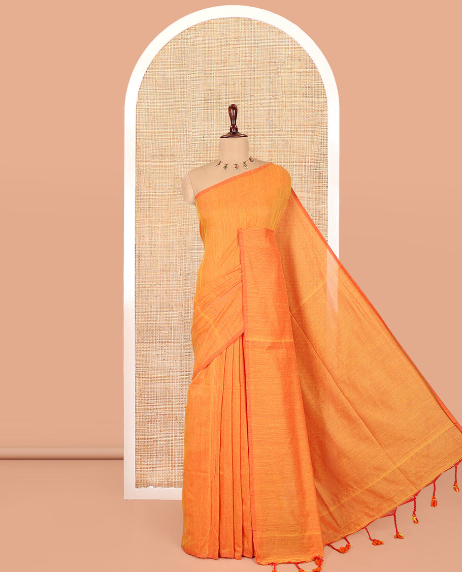Borderless Orange Plain Khadi Cotton Saree, a Self-Pallu with Tassels, and a Matching Blouse