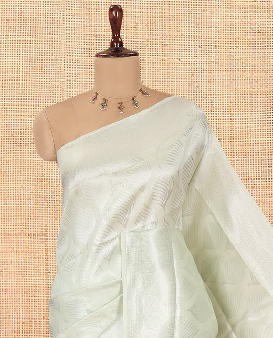 Liril Green Elite Soft Silk Saree, Subtly Sparkled with Ogee Jacquard Design, a Traditional Zari Border, Zari Pallu, and a Matching Blouse