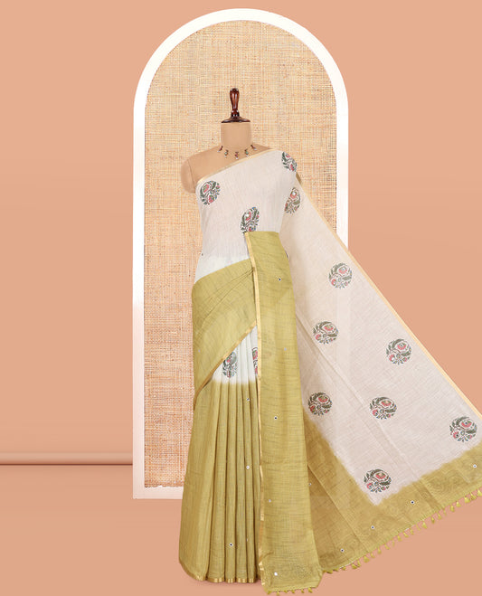 Cream-Green Linen Cotton Saree Features a Half-And-Half-Style Floral Butta and Mirror Work, a Piping Border, a Contrast Blouse