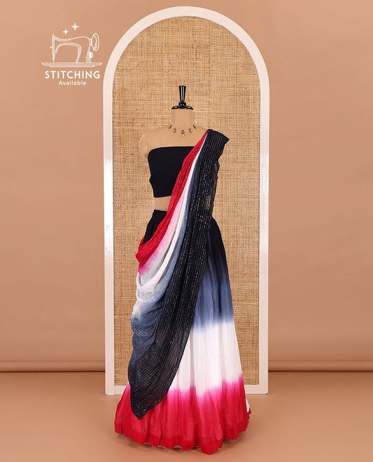 Multi-color half-saree, ombre-colored viscose georgette skirt, a plain black blouse, and a ombre-colored zari striped dhavani