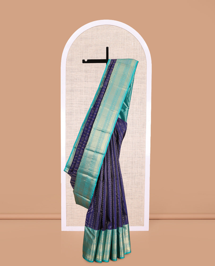 Blue Vasundhara Silk Saree Adorned with Jacquard Design Weave All Over Its Body, Complemented by a Contrast Border of Rekku, Muthu, Laddu Kamalam, Then Kuli Kann, and Dhavana Kodi Designs, Artfully Zari Woven Pallu, and Paired with a Contrast Blouse