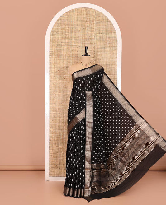 Black floral buttas discharge printed assam silk saree, chevron striped zari border, zari striped pallu, and a matching blouse