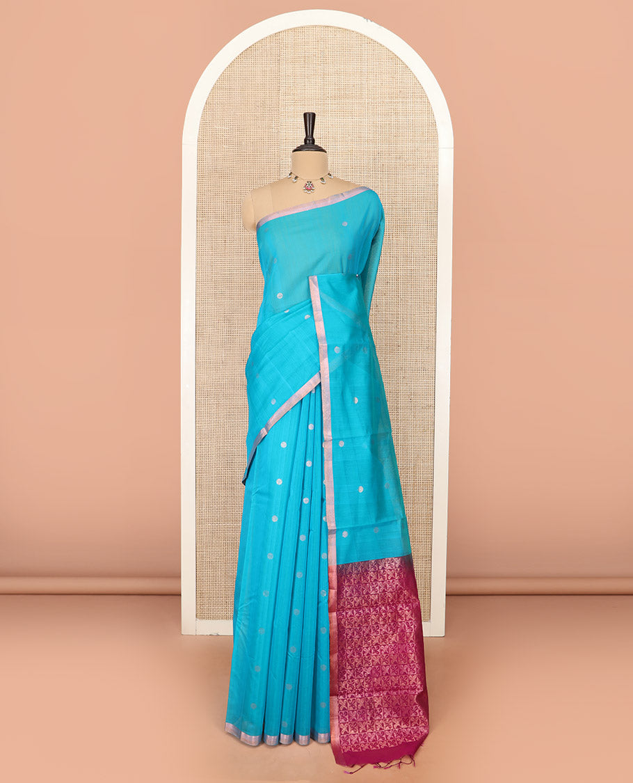 Blue Silk Cotton Saree Woven with Polka Dot Buttas All Over the Body, Subtly Woven Piping Border, Captivating Contrast Pallu of Floral Zari Designs, and Comes with a Contrast Blouse