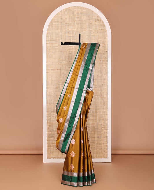 Mustard semi-soft silk saree with floral zari buttas, contrast traditional zari design border, & pallu of jaal designs