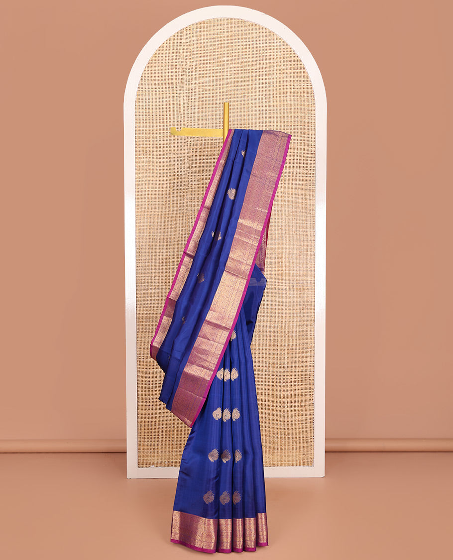 Blue Vasundhara Lite-Silk Mix Saree, Adorned with Zari Buttas, Complemented by Contrast Border Featuring Thilakam Mokku, Kodi Visiry, Muthu, Laddu Kamalam, and Mayil Designs, Grandly Pallu of Scallop Designs, and Paired with a Contrast Blouse