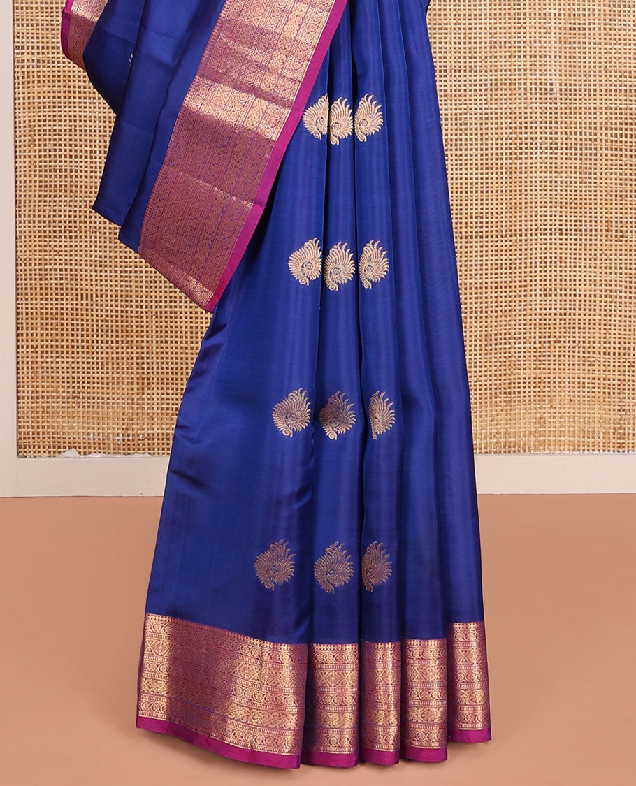 Blue Vasundhara Lite-Silk Mix Saree, Adorned with Zari Buttas, Complemented by Contrast Border Featuring Thilakam Mokku, Kodi Visiry, Muthu, Laddu Kamalam, and Mayil Designs, Grandly Pallu of Scallop Designs, and Paired with a Contrast Blouse