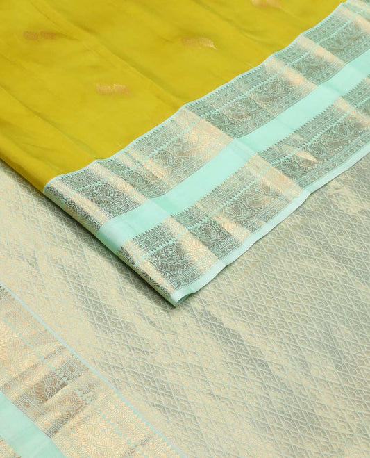 Green zari buttas Vasundhara silk mix saree, contrast rettai pettu border of rekku, rudraksham, and mayil designs and zari rich jaal pallu