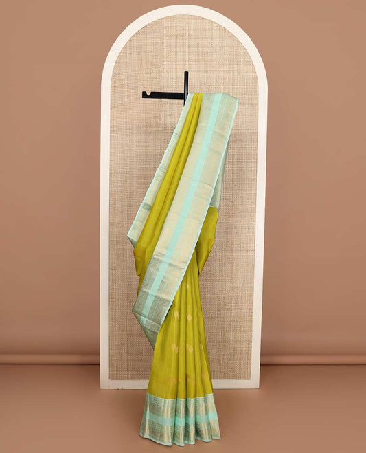 Green zari buttas Vasundhara silk mix saree, contrast rettai pettu border of rekku, rudraksham, and mayil designs and zari rich jaal pallu