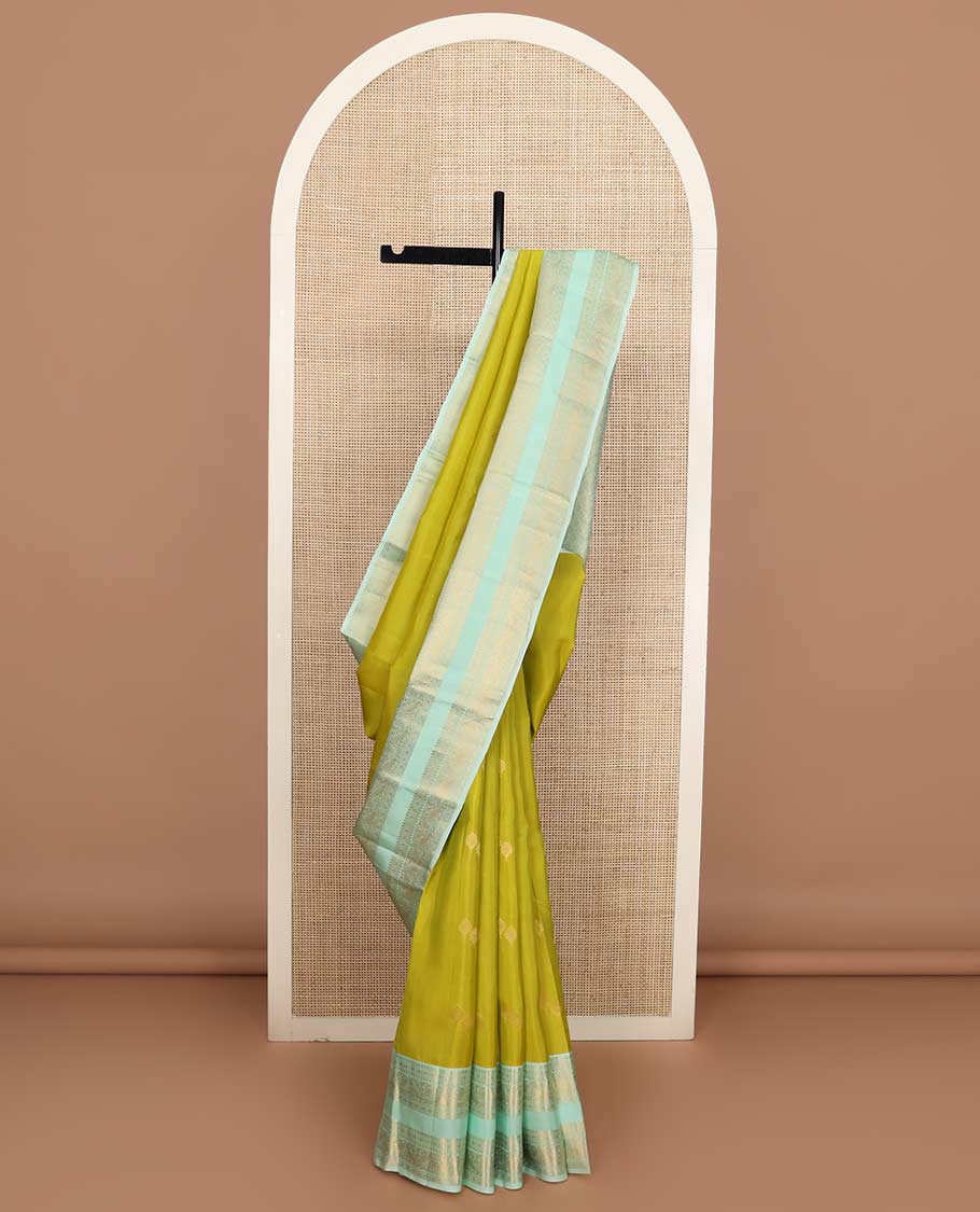 Green zari buttas Vasundhara silk mix saree, contrast rettai pettu border of rekku, rudraksham, and mayil designs and zari rich jaal pallu