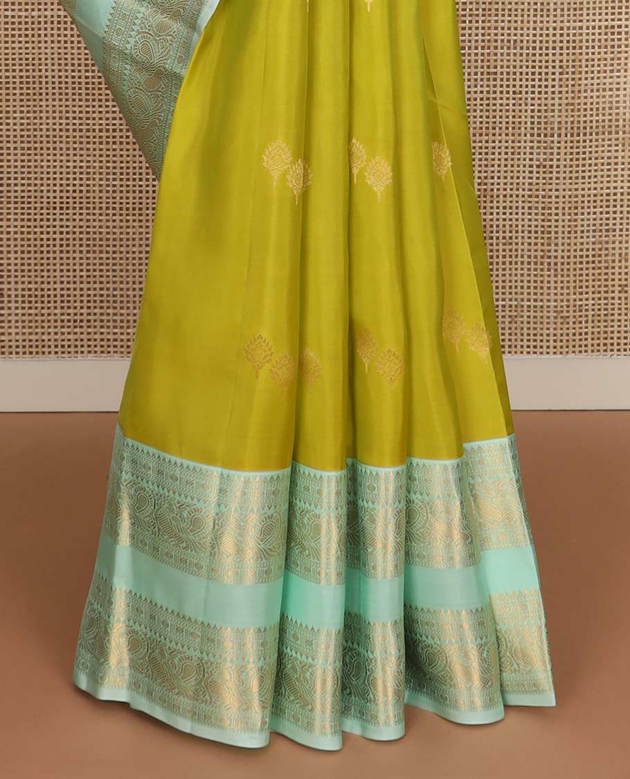 Green zari buttas Vasundhara silk mix saree, contrast rettai pettu border of rekku, rudraksham, and mayil designs and zari rich jaal pallu