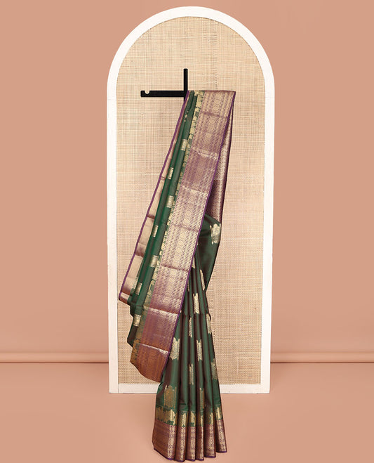 Green Vasundhara Lite Silk Mix Saree, Prettified with Zari Buttas on Its Body, Complemented by a Contrast Wedding-Themed Motifs Woven Border of Geometric Designs, Opulently Embellished Pallu, and Paired with a Contrast Blouse