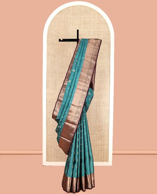 Green Vasundhara Lite Silk Mix Saree, Bedecked with Zari Buttas, Complemented by a Contrast Border of Mayil Kann and Kodi Visiry Designs, Floral Jaal Pallu, and a Contrast Blouse