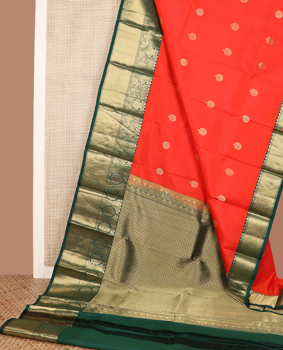 Red zari buttas silk saree, contrast border of rekku, iruthalai pakshi, yaanai, and mayil kann designs, and jaal pallu
