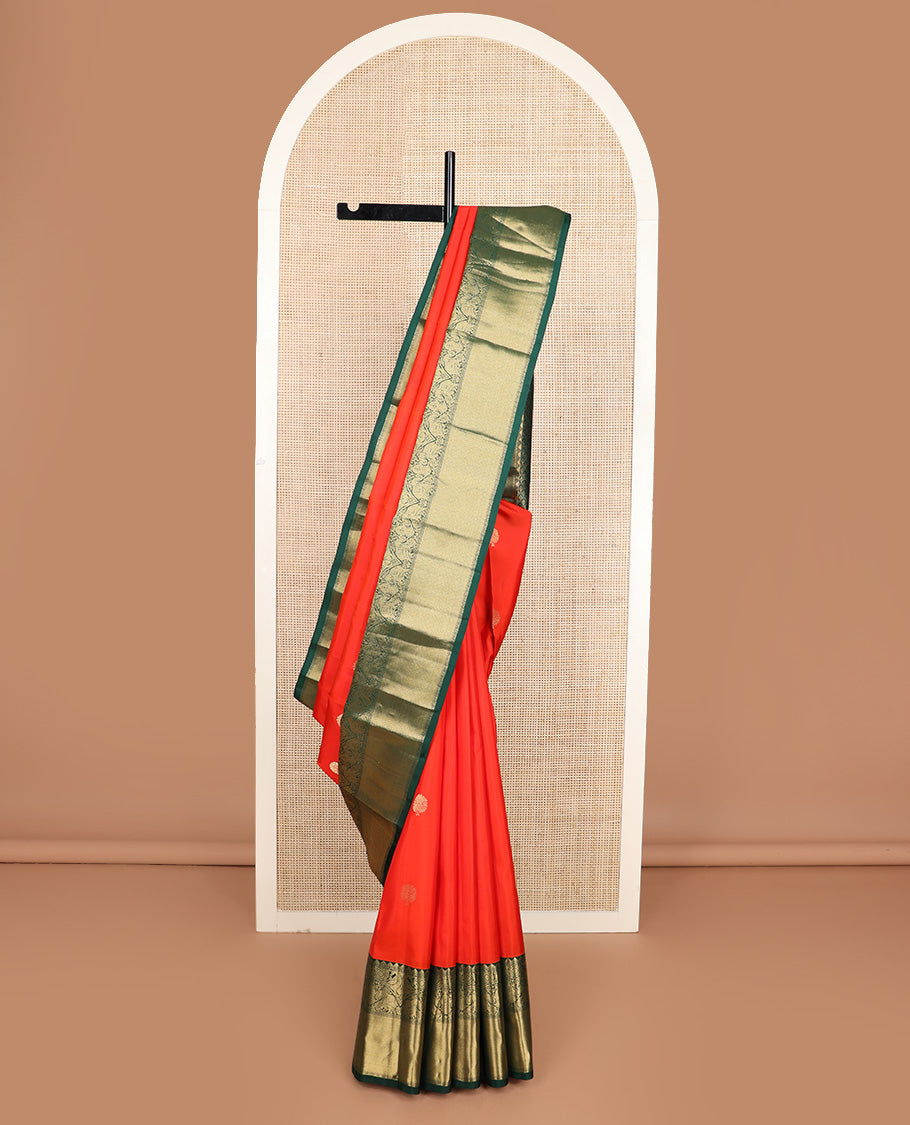 Red zari buttas silk saree, contrast border of rekku, iruthalai pakshi, yaanai, and mayil kann designs, and jaal pallu