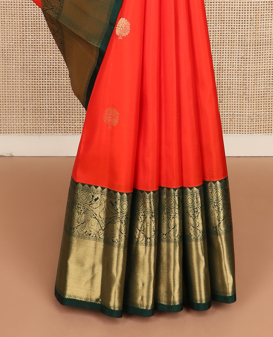 Red zari buttas silk saree, contrast border of rekku, iruthalai pakshi, yaanai, and mayil kann designs, and jaal pallu