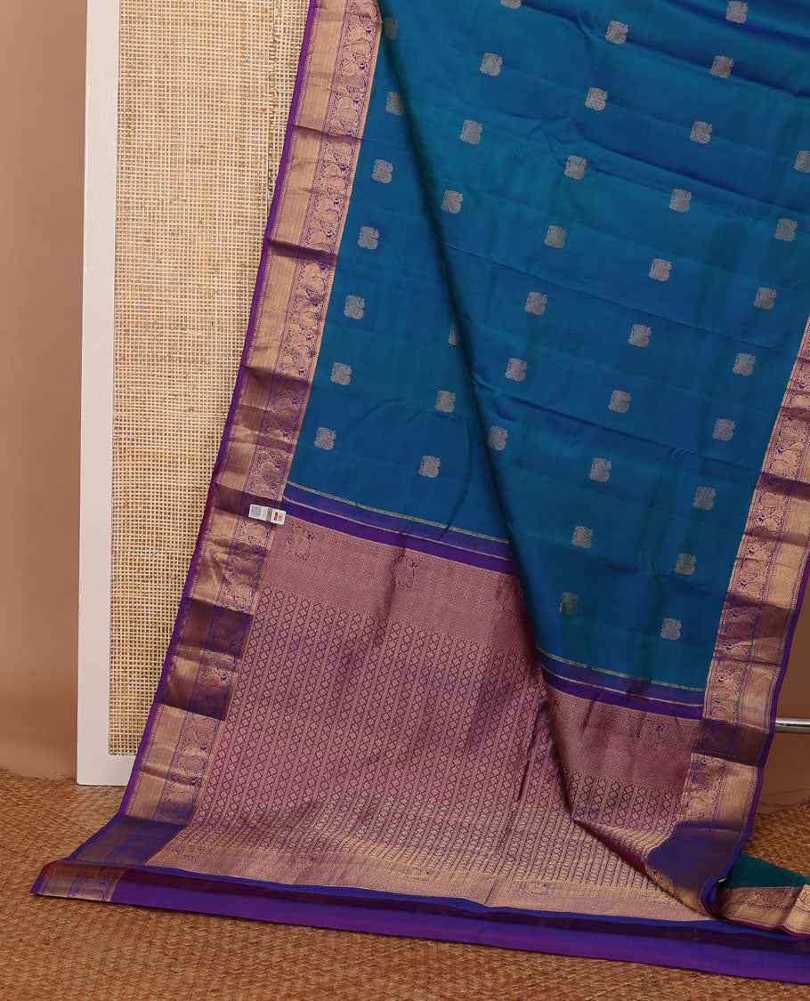 Blue mayil buttas zari woven silksaree, contrast border of mayil & mayil kann designs & diamond-patterned pallu